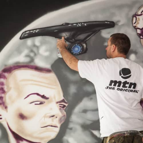 Graffiti artist painting