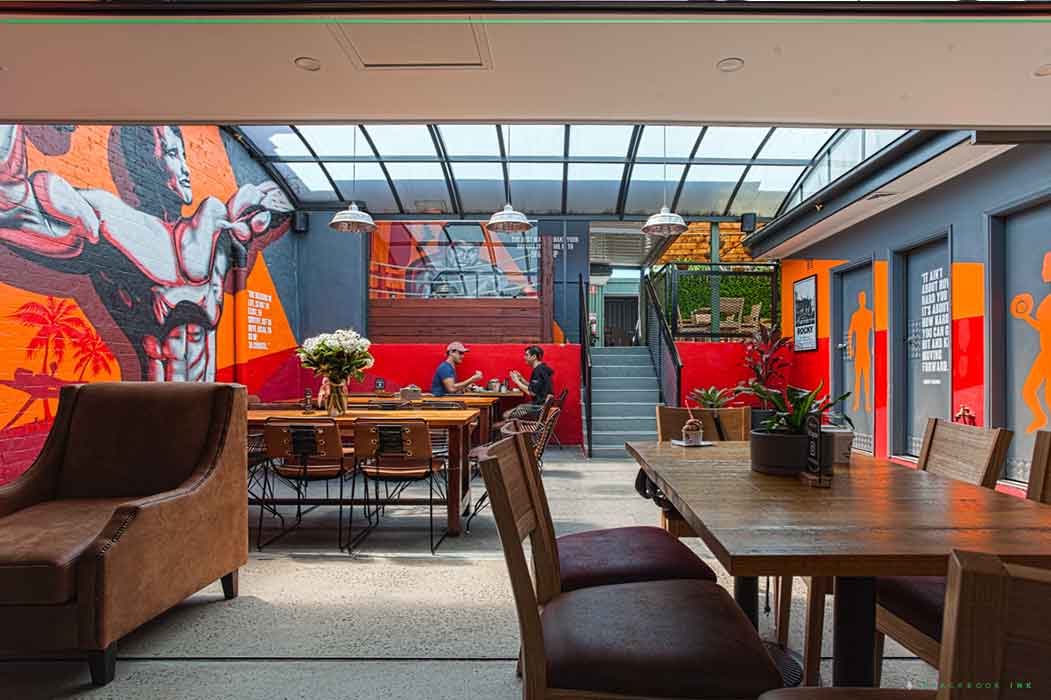 Custom business mural painted by Blackbook Ink for a commercial space