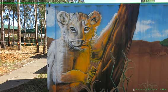 Shipping container painted mural for a school