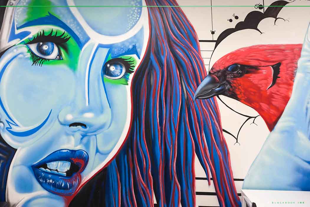 Mural artists hired to paint a technology based mural for a law firm