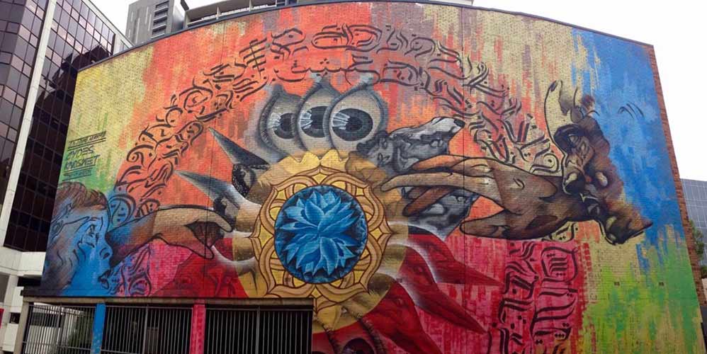 Large scale mural painted by Dcydes