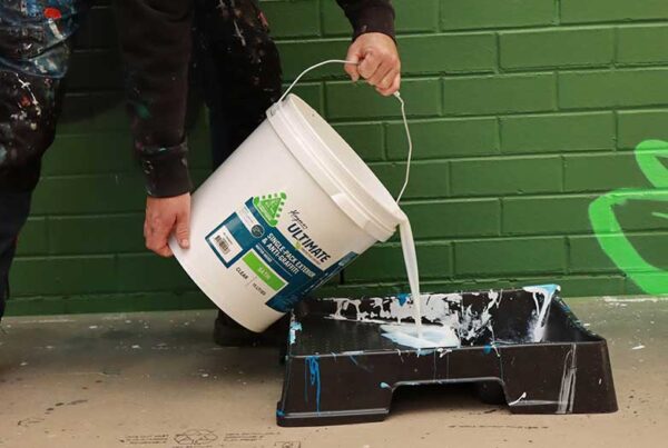 Getting ready to apply UV coating to a mural artwork