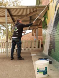 Our Mural Process 8 Graffiti removal services sydney - applying anti graffiti coating to wall