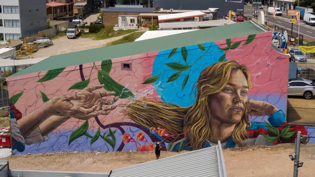 Reubszz mural painted on side of building