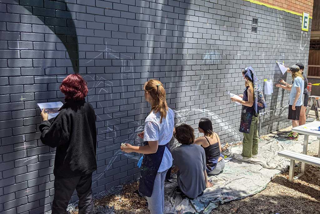 students involved with a graffiti workshop