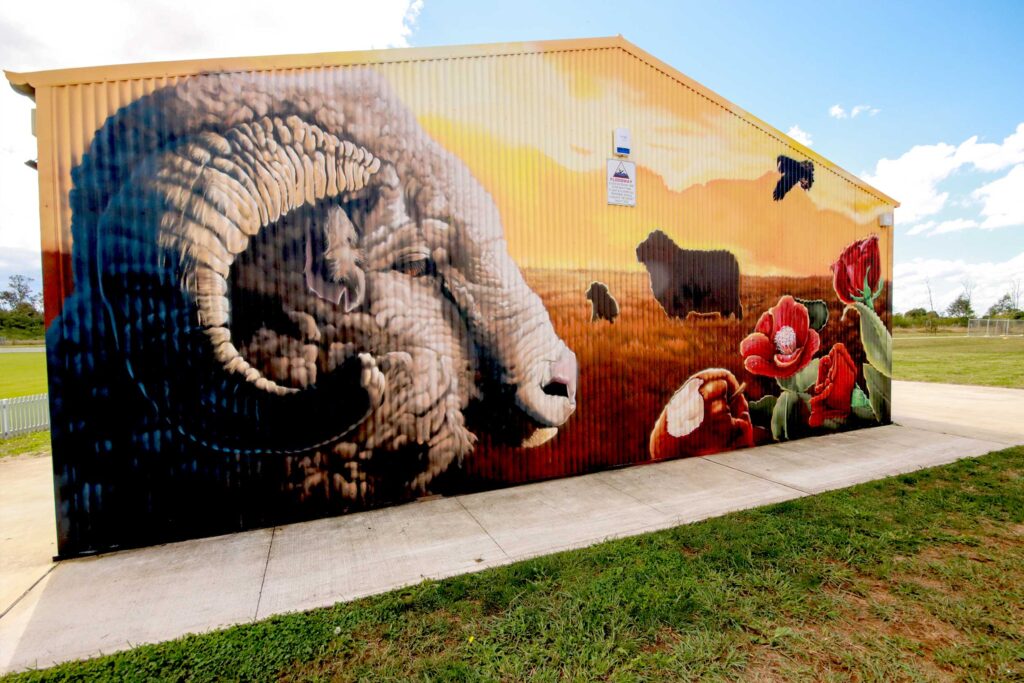 Vibrant mural at Ferguson Grounds featuring cricket scenes and community pride in Camden, NSW.