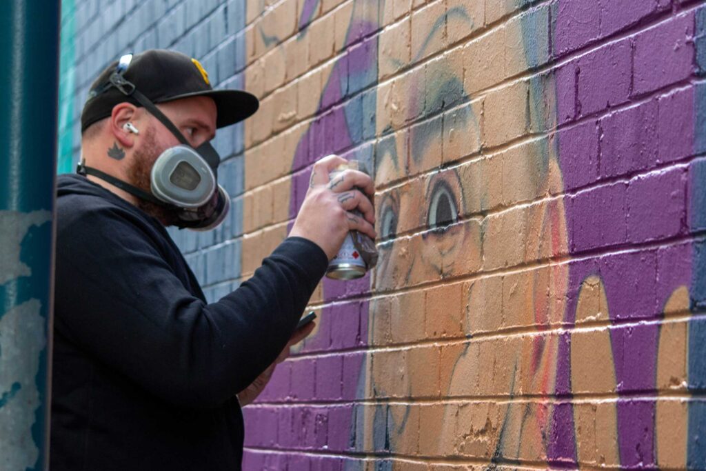 street artists Sydney - Painting a portrait