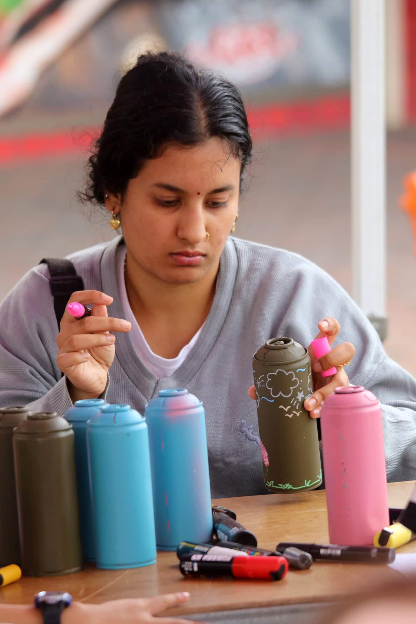 community workshop in Sydney creating artwork on empty spray cans