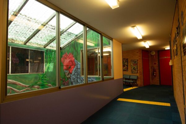 Hallway with mural inside of Atrium