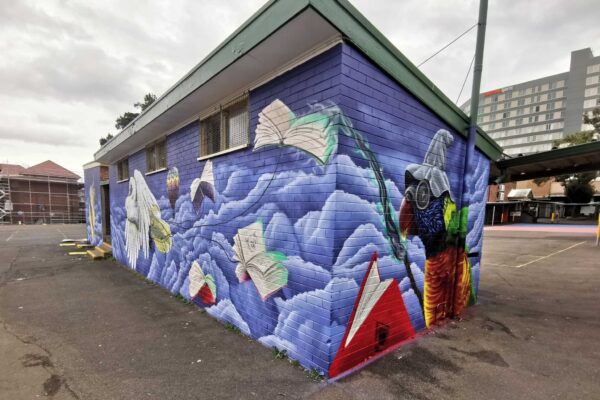 Fantasy theme mural painted on toilet block at Bankstown Public School