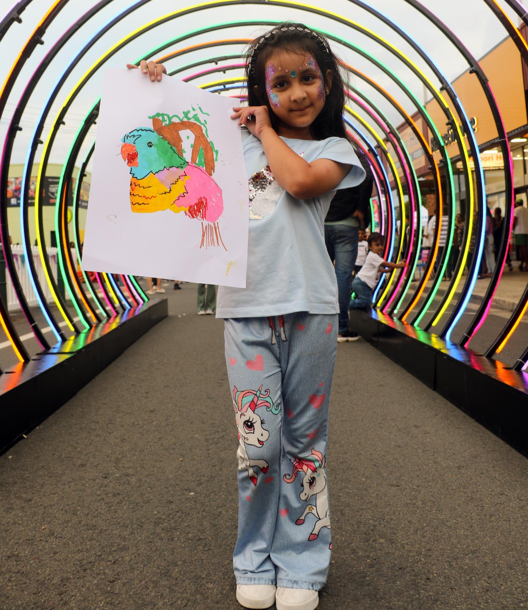 Youth holding up drawing run at council workshop in Ingleburn