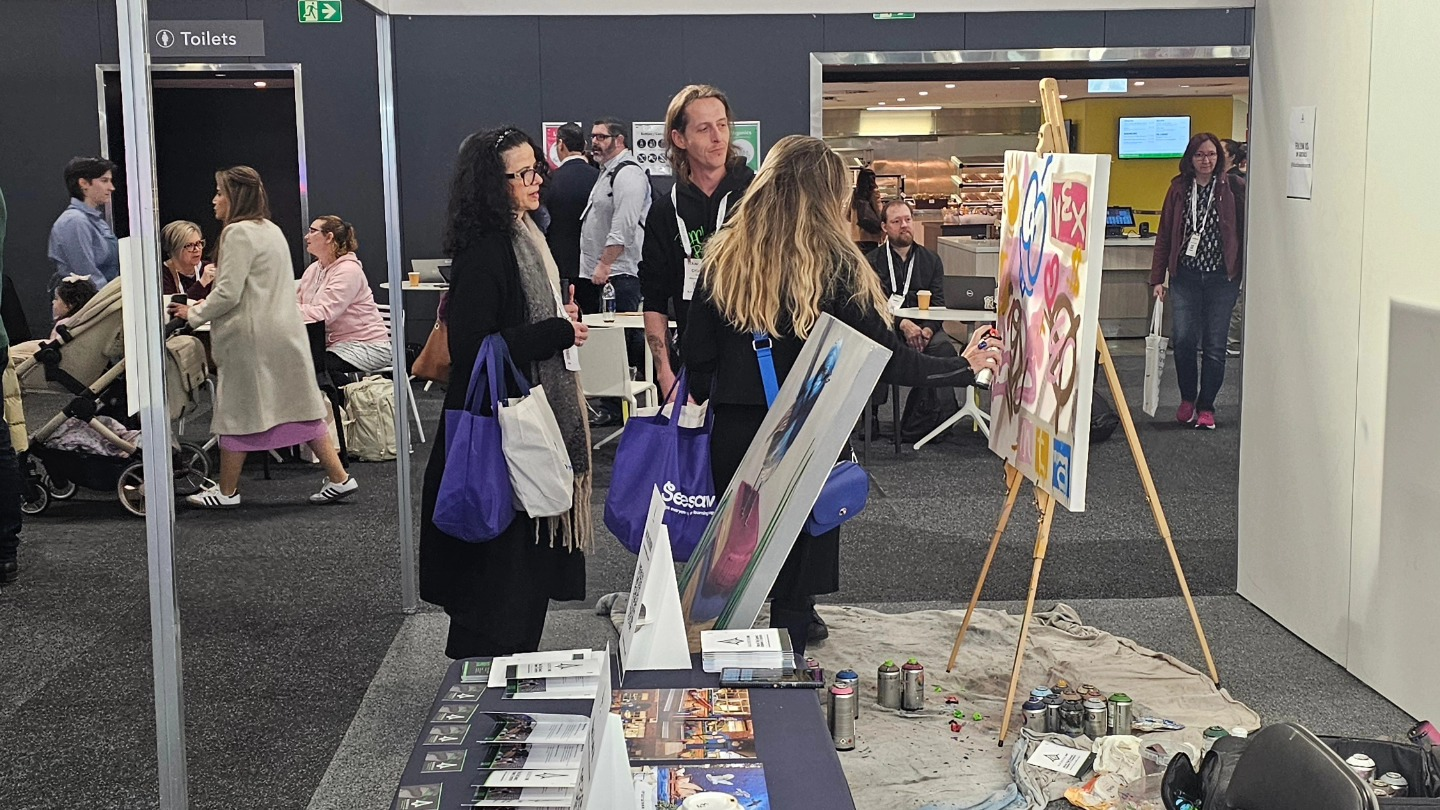 Guest participation at Sydney ICC painting a canvas